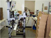 Top and Bottom Labeller with split conveyor and product transfer side drives.